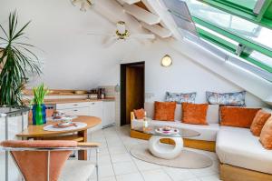 a living room with a couch and a table at Bodenseeblick in Meersburg