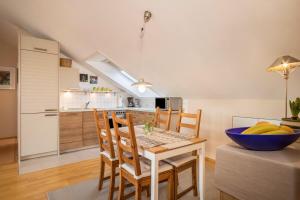a kitchen and dining room with a table and chairs at Schwippl in Meckenbeuren