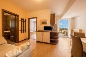 a room with a kitchen and a living room at Residence Kronstein - Fewo 2 in Tesimo