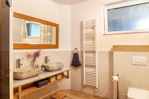 two sinks in a bathroom with a mirror at Maierhof 341 in See +37 photos