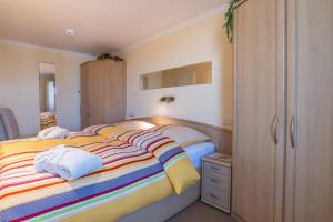 a bedroom with a bed with two pillows on it at Sylter Residenz Westerland in Westerland