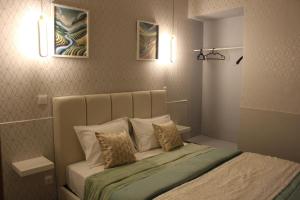 a bedroom with a bed with two pillows on it at D'ouro Prestige Relax in Sanfins do Douro +21 photos