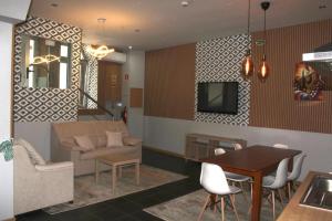 a living room with a couch and a table at D'ouro Prestige Relax in Sanfins do Douro