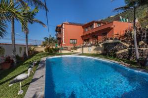 a swimming pool in front of a house at Casa Victor - Apartment 4 in La Orotava