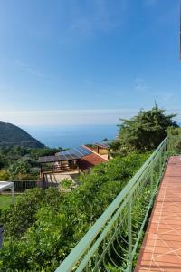 a view of the ocean from the balcony of a house at Il Cisto in Marciana