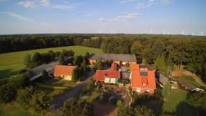 an aerial view of a house with an orange roof at Ferienwohnung Haarkotten in Steinfurt