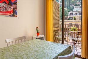 a room with a table and a view of a balcony at Can Maryel in Tossa de Mar