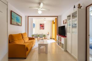 a living room with a couch and a table at Can Maryel in Tossa de Mar