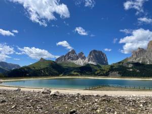a view of a mountain lake in the mountains at Fedaia Joy Bnb in Canazei