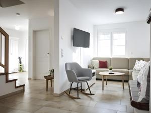 a living room with a couch and a table at Ferienhaus Elsa 180 qm in Rust