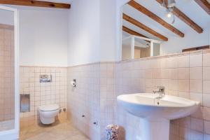 a bathroom with a sink and a toilet at Villa Can Got in Sóller +21 photos