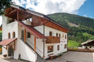 a house with a view of a mountain at Ferienhaus Berger in Sarntal
