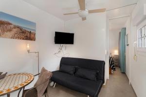 a living room with a couch and a table at Casa Paula - 21 in Arinaga