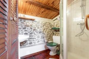 a bathroom with a toilet and a sink at La Fenière - Maison avec terrasse in Collobrières