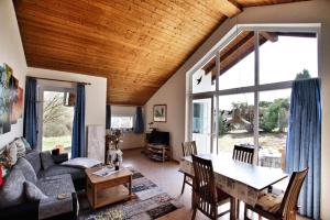 a living room with a couch and a table at Ferienhaus Uslar Gmbh Uslar in Uslar