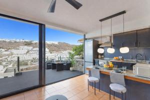 an open kitchen with a view of the city at Arizona's Bay in Puerto Rico de Gran Canaria