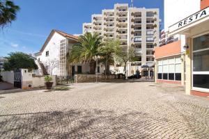 an empty street in front of a building at Luxury Beach View - Praia da Rocha in Portimão