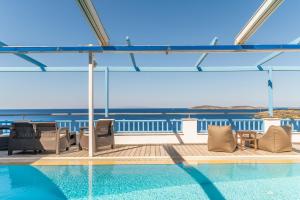 a swimming pool on the deck of a cruise ship at Blue Waves View Andros in Andros