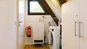 a room with a water heater and a fire hydrant at Ferienhaus Auszeit mit Terrasse in Tennenbronn