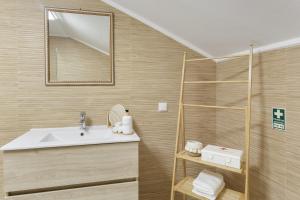a bathroom with a sink and a shower at Sky and Sea Haven in Santa Cruz +18 photos