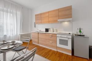 a kitchen with a table and a dining room at Ferienwohnung Merzig in Merzig