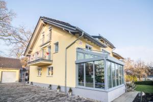 a house with a large window on the side of it at Haus Ruther - Wohnung 2 in Bad Saulgau