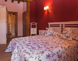 a bedroom with a large bed with a white bedspread at Montes De Alhama in Villarraso