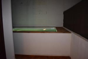 a closet with a green object on a shelf at Cas Bunyoler in Cala Ratjada