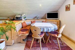 a dining room with a table and chairs at Haus am Mühlenbach in Hilzingen