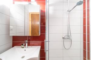 a bathroom with a sink and a shower at Arianna Studio Ground Floor 8 in Paleokastritsa +13 photos