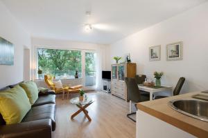 a living room with a couch and a table at Ferienwohnung Rübezahl in Brilon