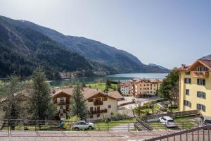 a view of a town with a lake and mountains at Casa Batistei Ribes in Molveno