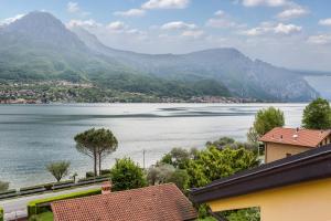 a view of a large body of water with mountains at New Eleven Apartment on Como Lake in Oliveto Lario