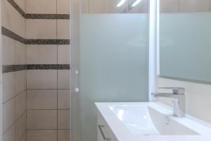 a bathroom with a sink and a mirror at Le Luna in Vindelle +18 photos