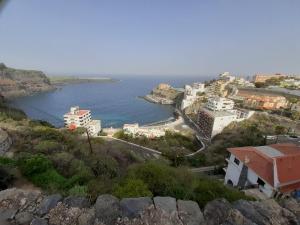 a view of a town on a hill next to the water at Casa Matyas in Icod de los Vinos