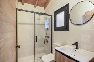 a bathroom with a shower and a sink and a mirror at Finca Los Tilos Moya in Moya +37 photos