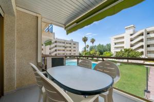 a balcony with a table and chairs and a view at Cambrils park in Cambrils