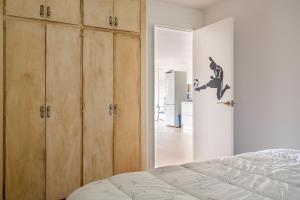 a bedroom with wooden cabinets and a bed at Ca La Nyca in Tossa de Mar