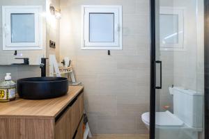 a bathroom with a sink and a toilet at Ca La Nyca in Tossa de Mar +13 photos