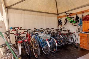 a bunch of bikes parked in a garage at Oasis on the river 2 in Marina di Pisa