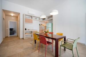 a kitchen and dining room with a table and chairs at Villa Capobianco in Polignano a Mare