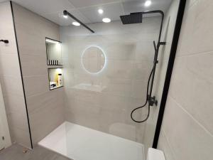 a shower with a glass door in a bathroom at Apartamento Ejido Centro in El Ejido +13 photos