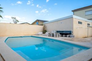 a swimming pool in the backyard of a house at Caseta de l'avi in Camarles
