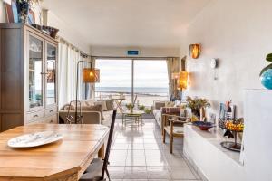 a living room with a view of the ocean at Chambre d'hôtes - Le quartier haut in Sète +15 photos