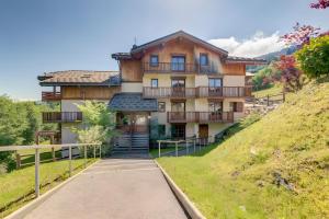 a large house on a hill with a pathway at Les evettes 4-6 couchages in Flumet