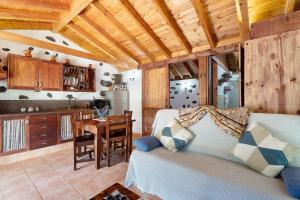 a living room with a couch and a table at Casa Rural Medina 2 in San Sebastián de la Gomera