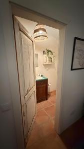 an open door to a bathroom with a sink at Sítio Do Valverde in Coruche