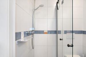 a bathroom with a shower and a toilet at Refugium aus Vollholz in Schlitz +16 photos