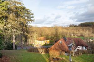 a group of houses in a field with trees at Refugium aus Vollholz in Schlitz