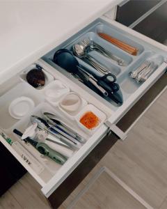 a drawer filled with utensils in a kitchen at Chigasaki Southern Beach House 茅ヶ崎サザンビーチハウス in Chigasaki